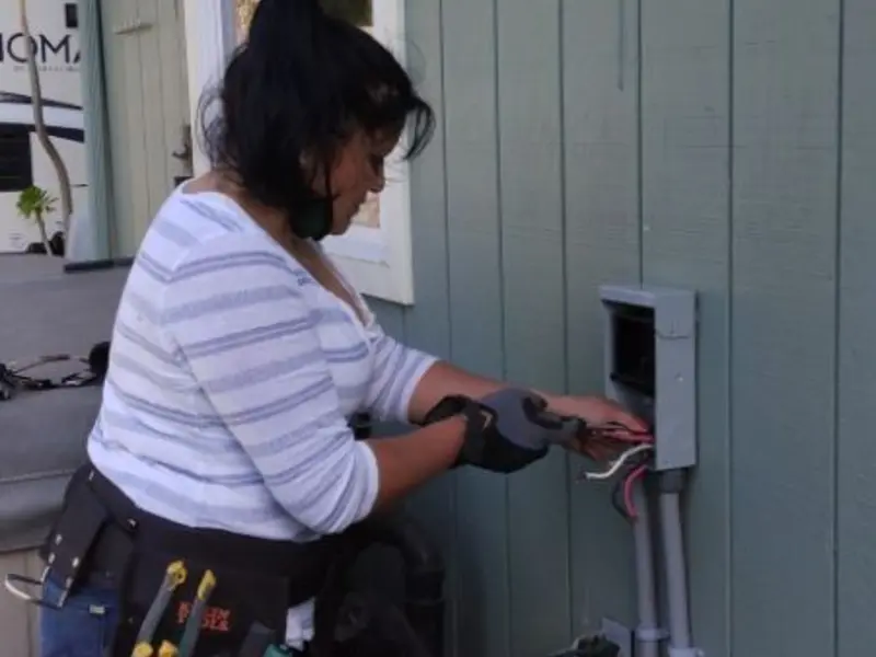 Licensed electrician wiring an exterior subpanel in Temple Hills